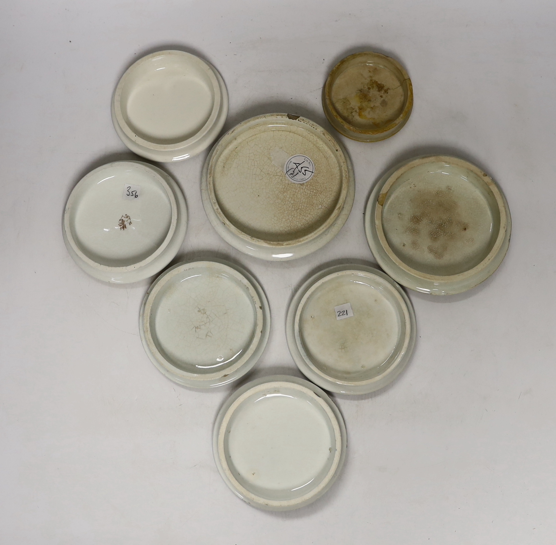 Eight Victorian ceramic Prattware pot lids, including ‘Alas Poor Bruin’ scene with bear, largest 13cm